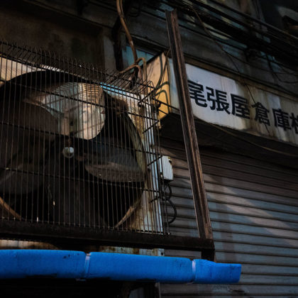 Rusty outdoor unit, signboard, and shutter